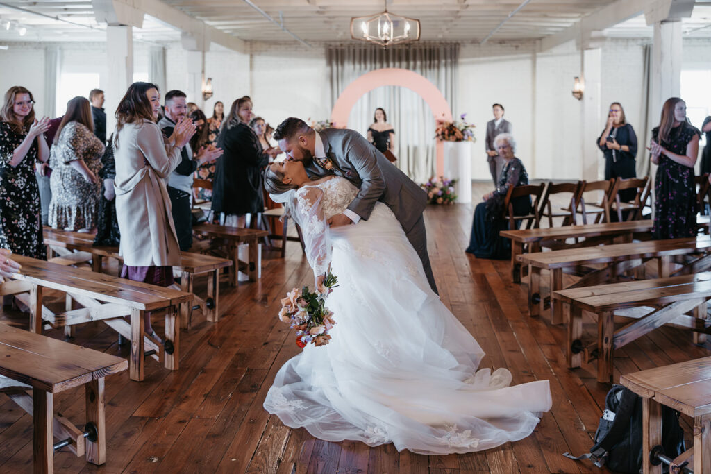 bride and groom kiss photo