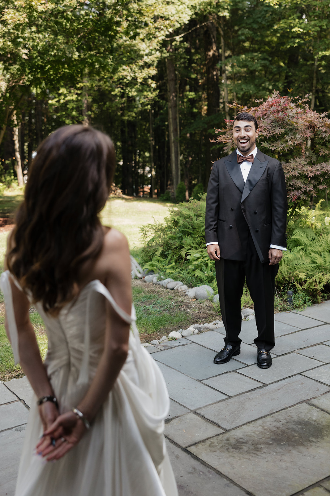 Groom reacting during an emotional first look at The Mod House in Ellenville, NY surrounded by Catskills greenery.