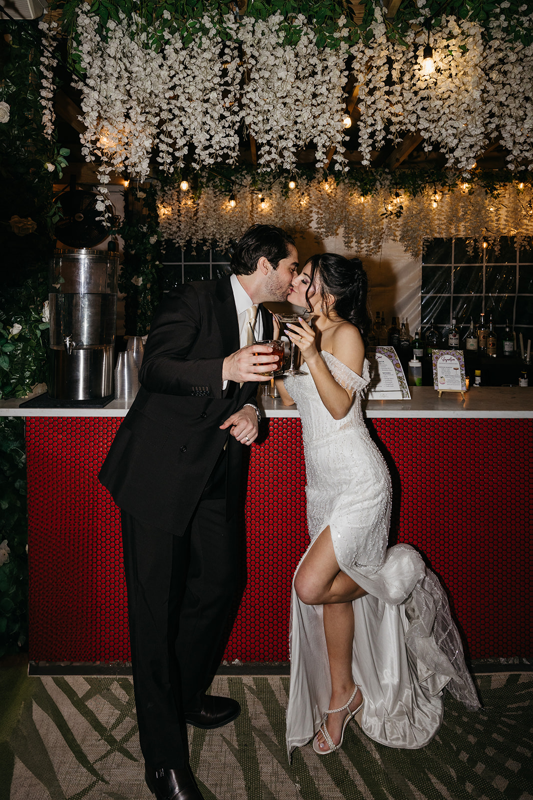 playful shot of a bride and groom kissing at the Sancutary RI