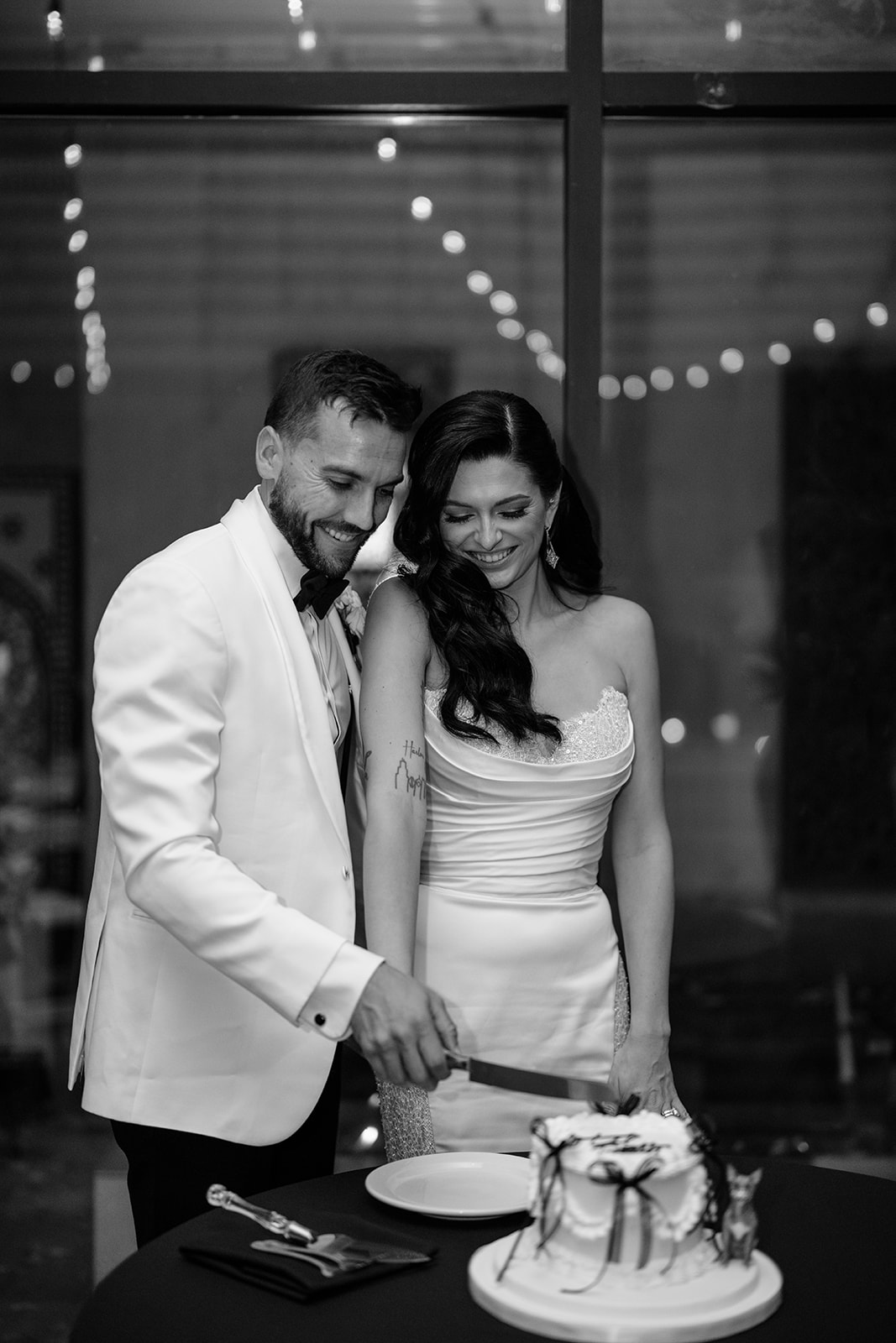 Bride and groom cutting their wedding cake during their Galleria Marchetti wedding reception in Chicago