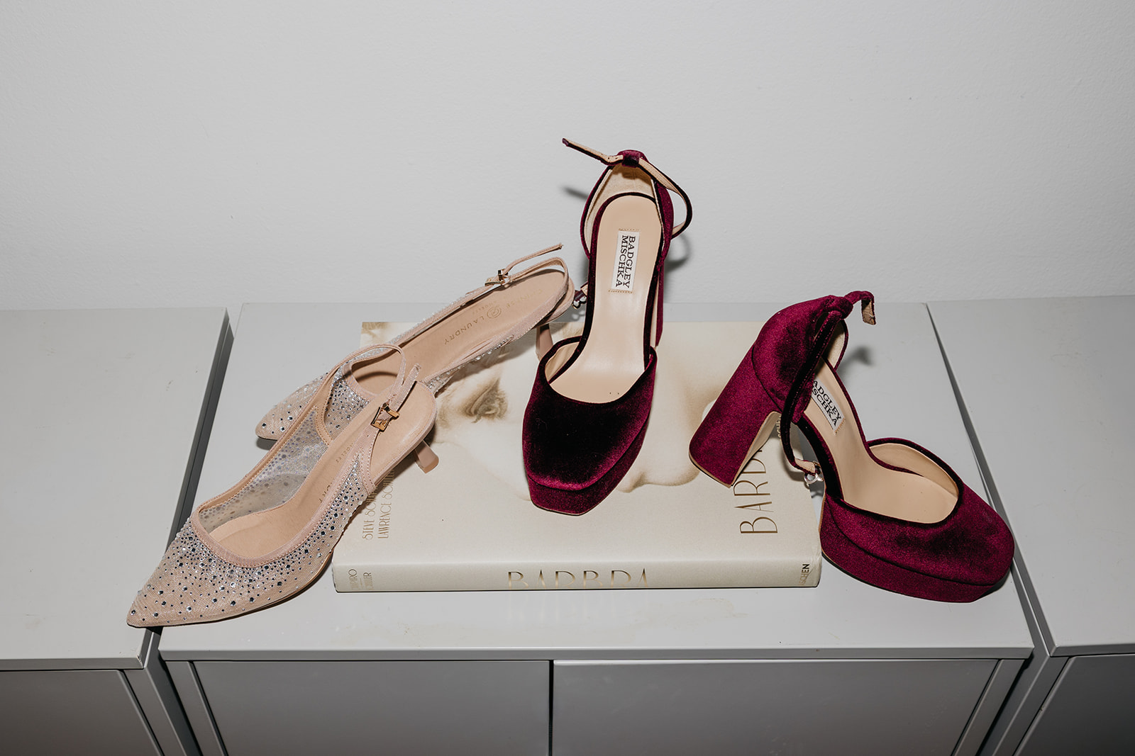 Wedding shoes detail with red velvet heels and embellished flats styled for NYC wedding