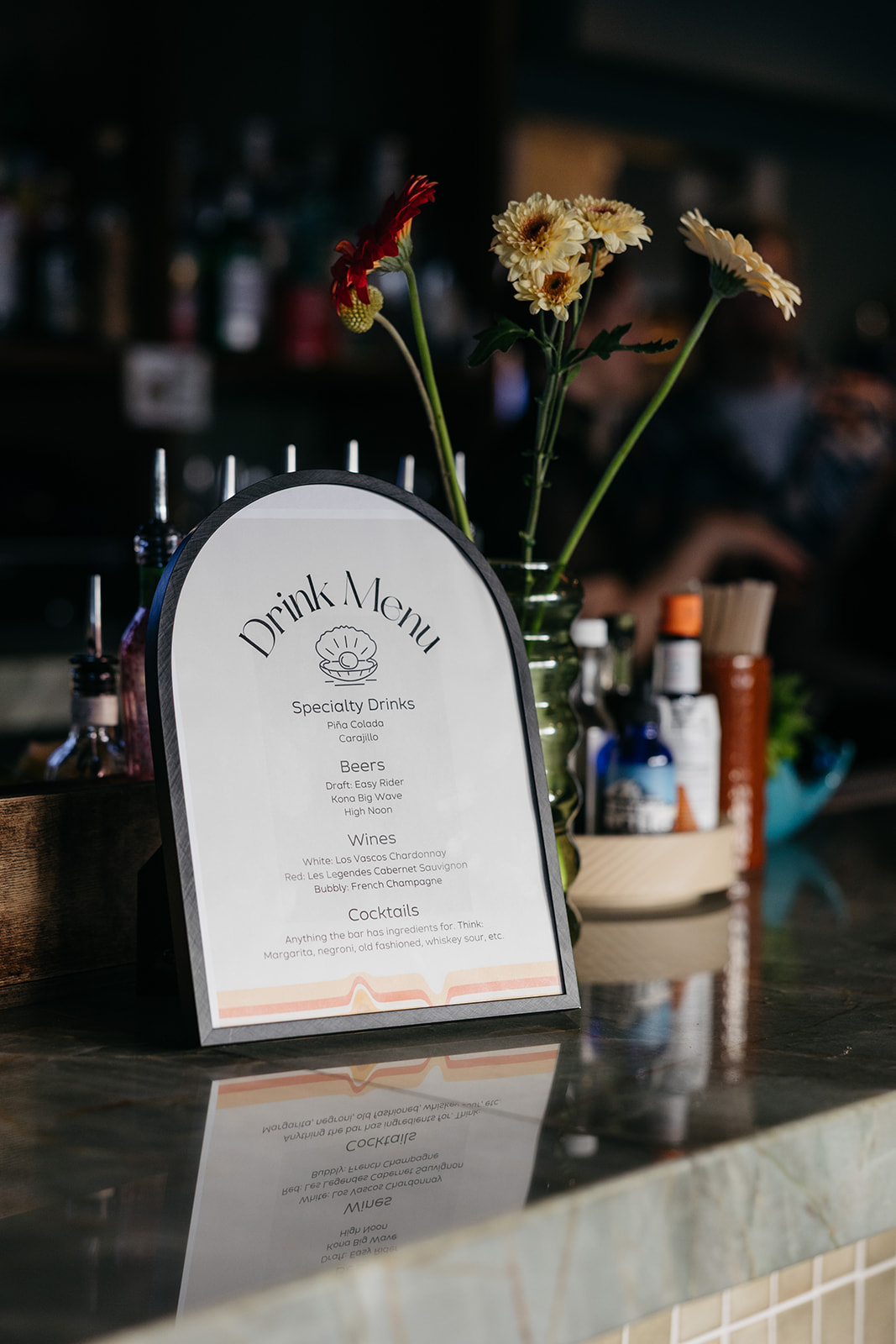 Cocktail bar setup with drink menu and florals, detail shot San Diego wedding photography