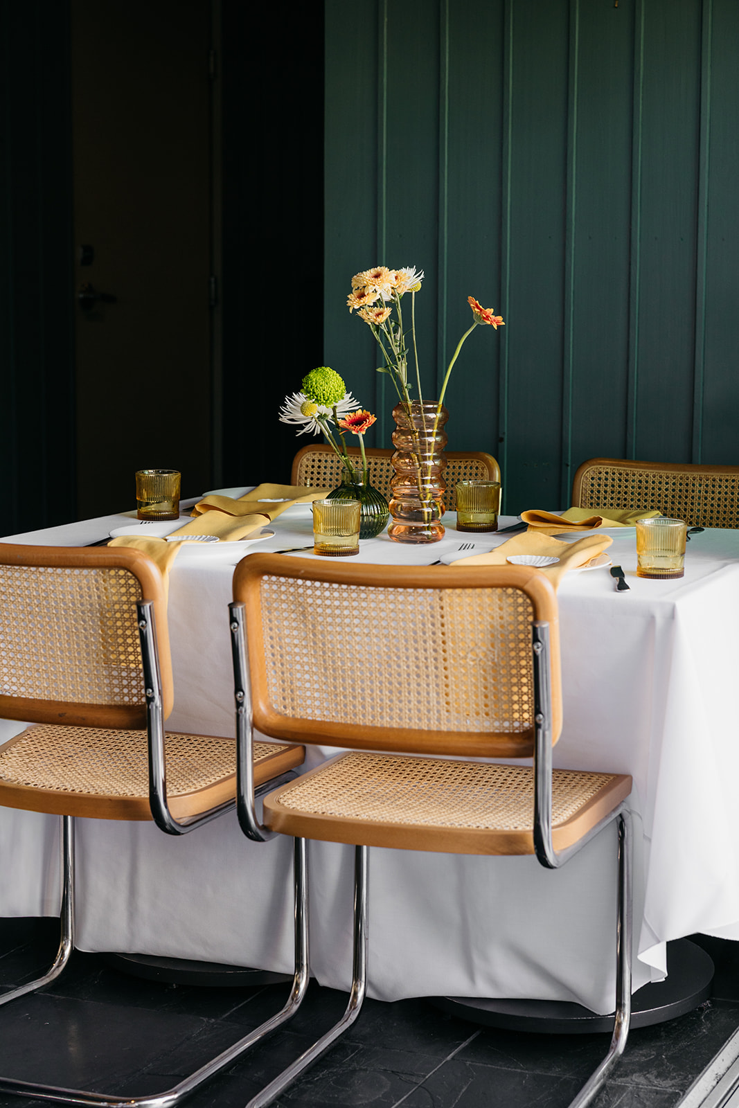 Intimate reception table setup with florals, candles, and modern chairs at the pearl san diego wedding