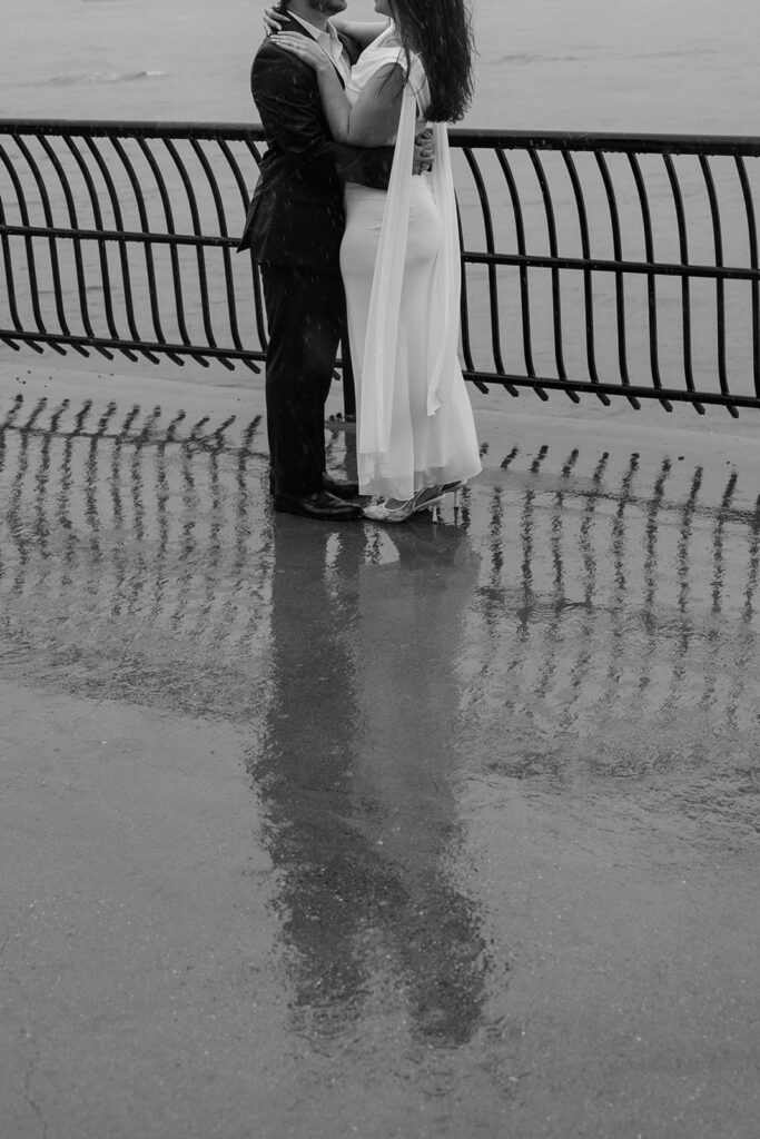 Artistic shot of a couple standing in water for their NYC engagement session