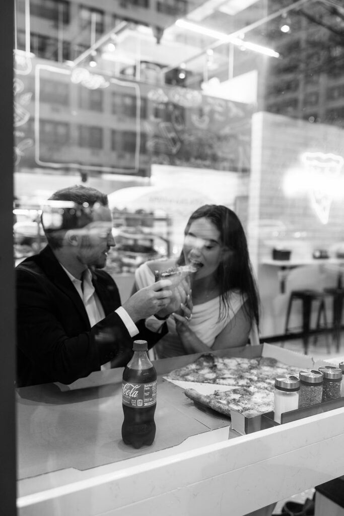 Creative engagement NYC photo of couple eating pizza